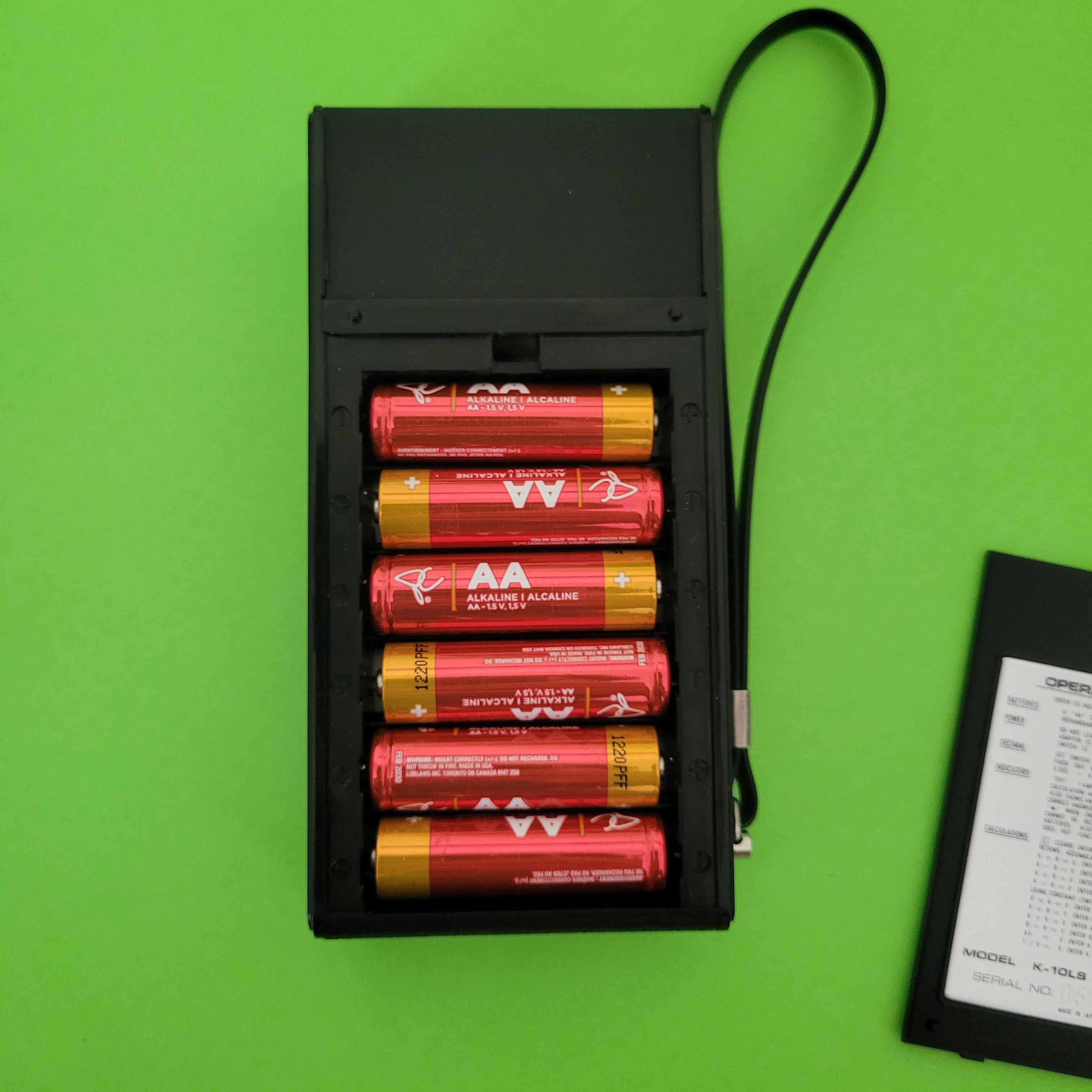 An image of the battery compartment of a I.T.C. four function + calculator